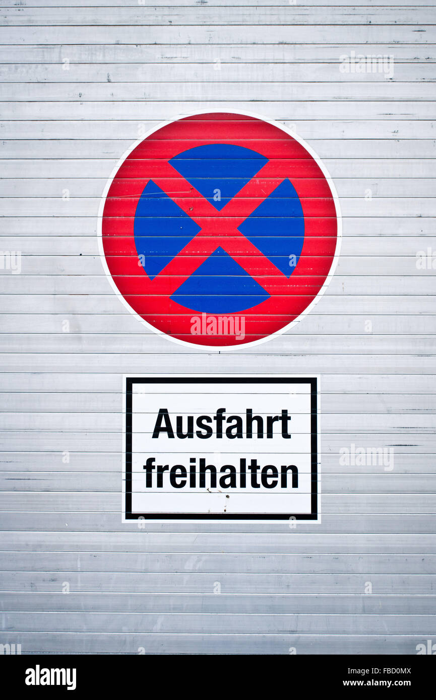 A sign on a metal surface in German meaning `keep clear' Stock Photo